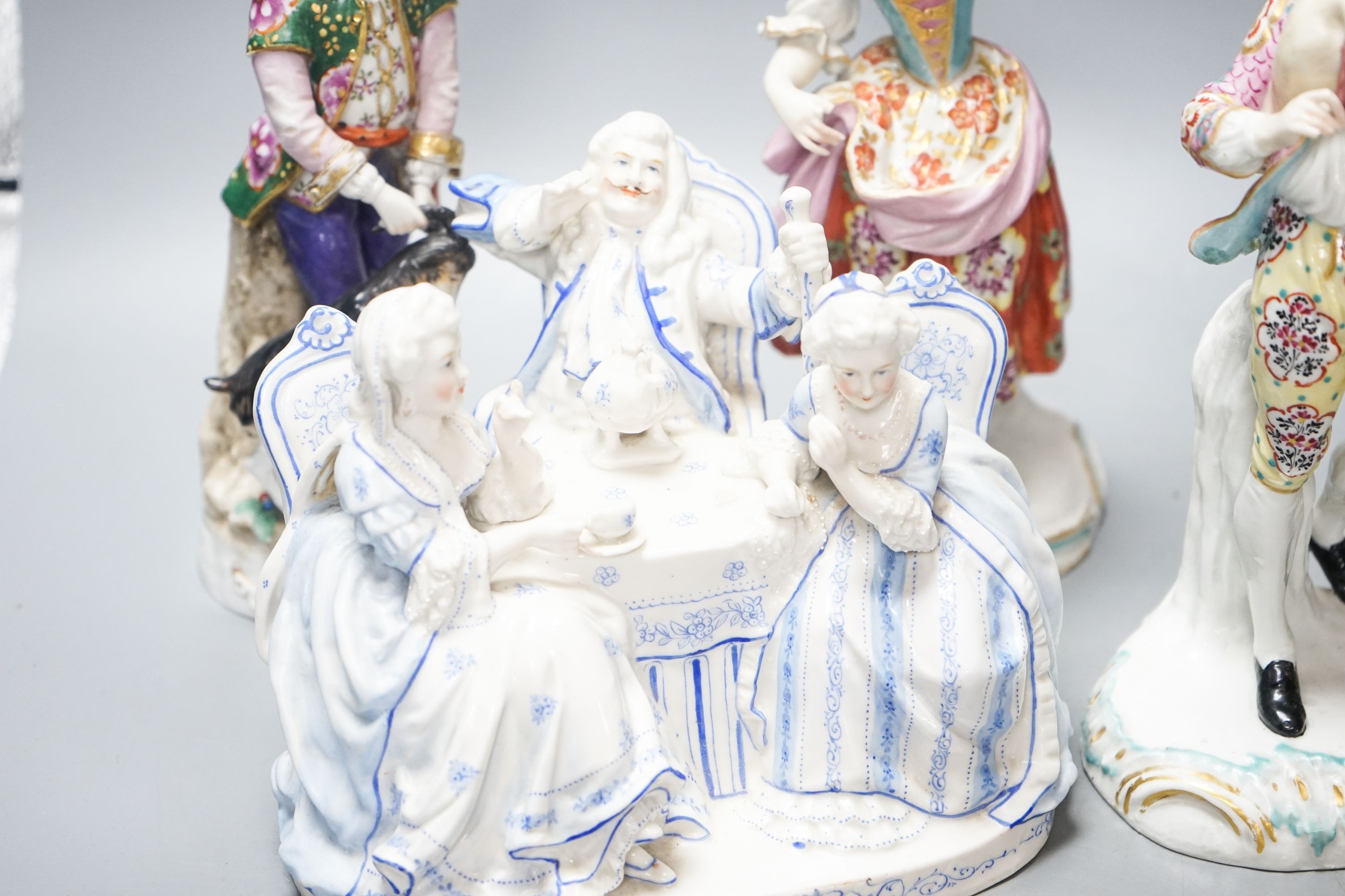 A Sitzendorf group of a Shepherd and shepherdess, three other Continental costume figures and a group (5) 27cm
